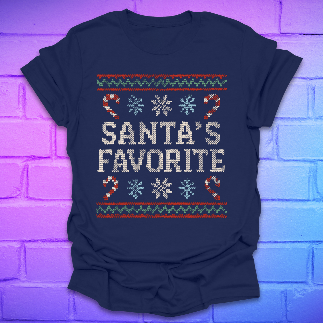 Navy t-shirt with Christmas-themed design, and text, 'Santa's Favorite' on a brick wall background