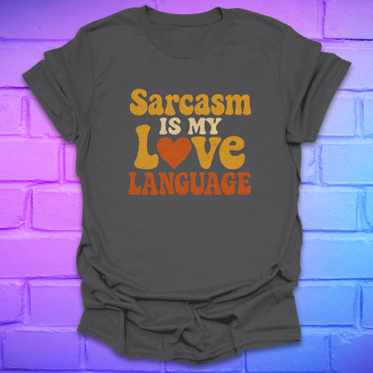 Gray t-shirt with 'Sarcasm is my love language' text on a brick wall background
