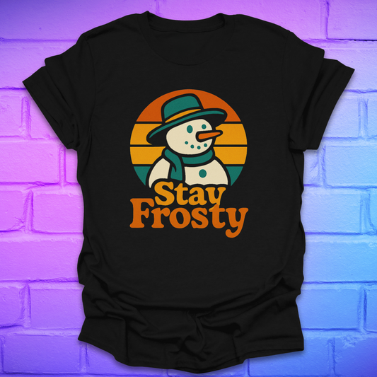 Black t-shirt with a snowman graphic and 'Stay Frosty' text on a brick wall background