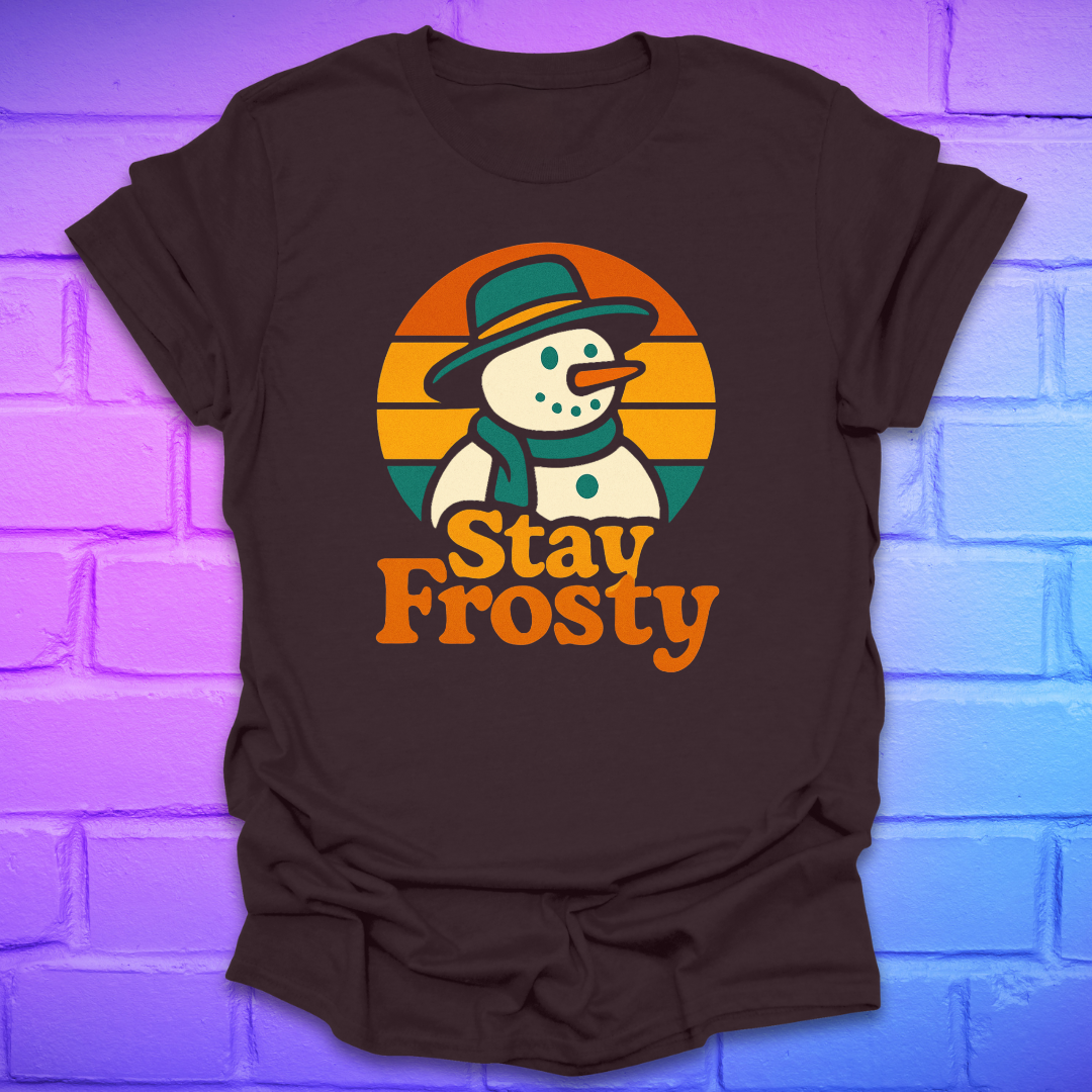 Brown t-shirt with a snowman graphic and 'Stay Frosty' text on a brick wall background
