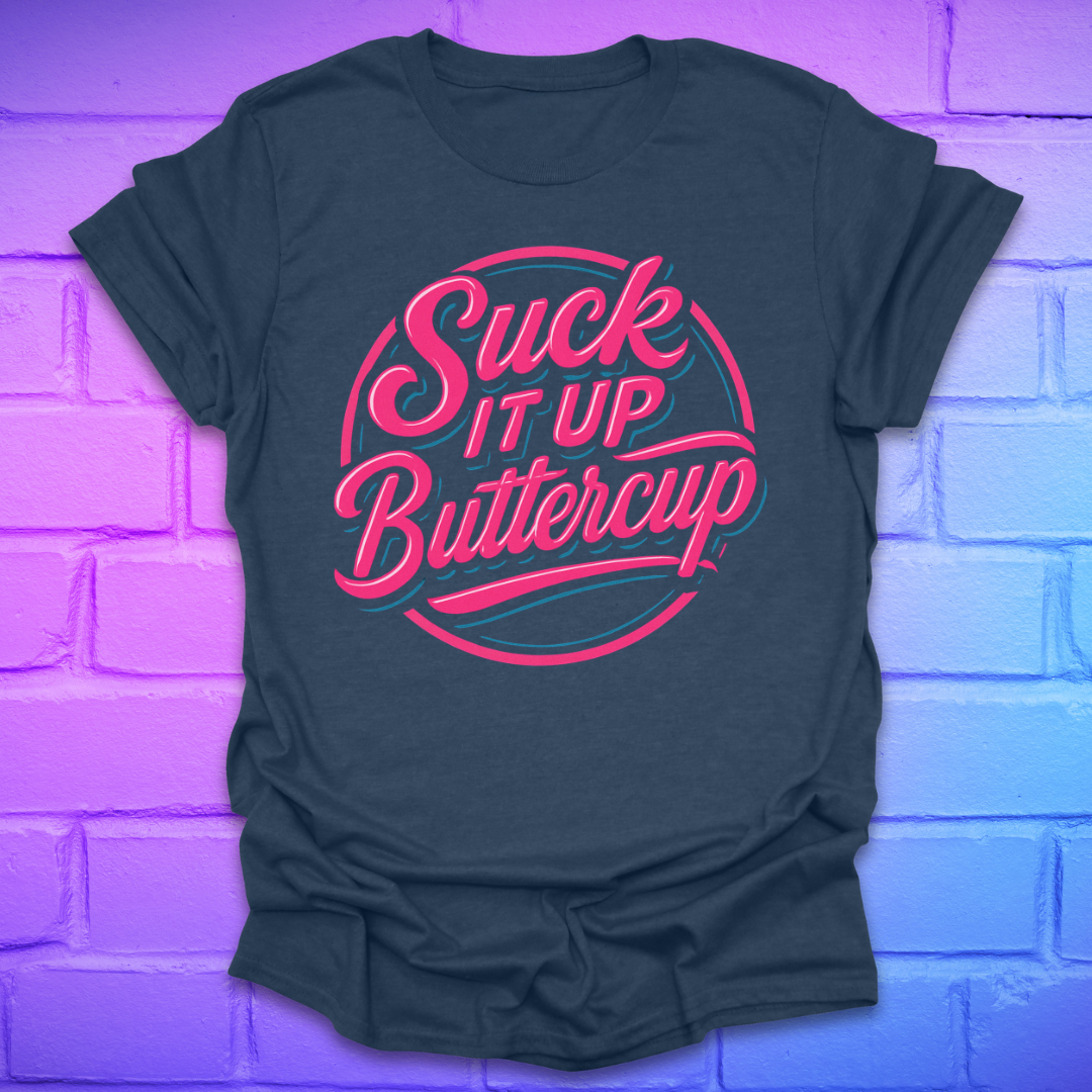 Black t-shirt with 'Suck It Up Buttercup' text in pink and teal on a brick wall background