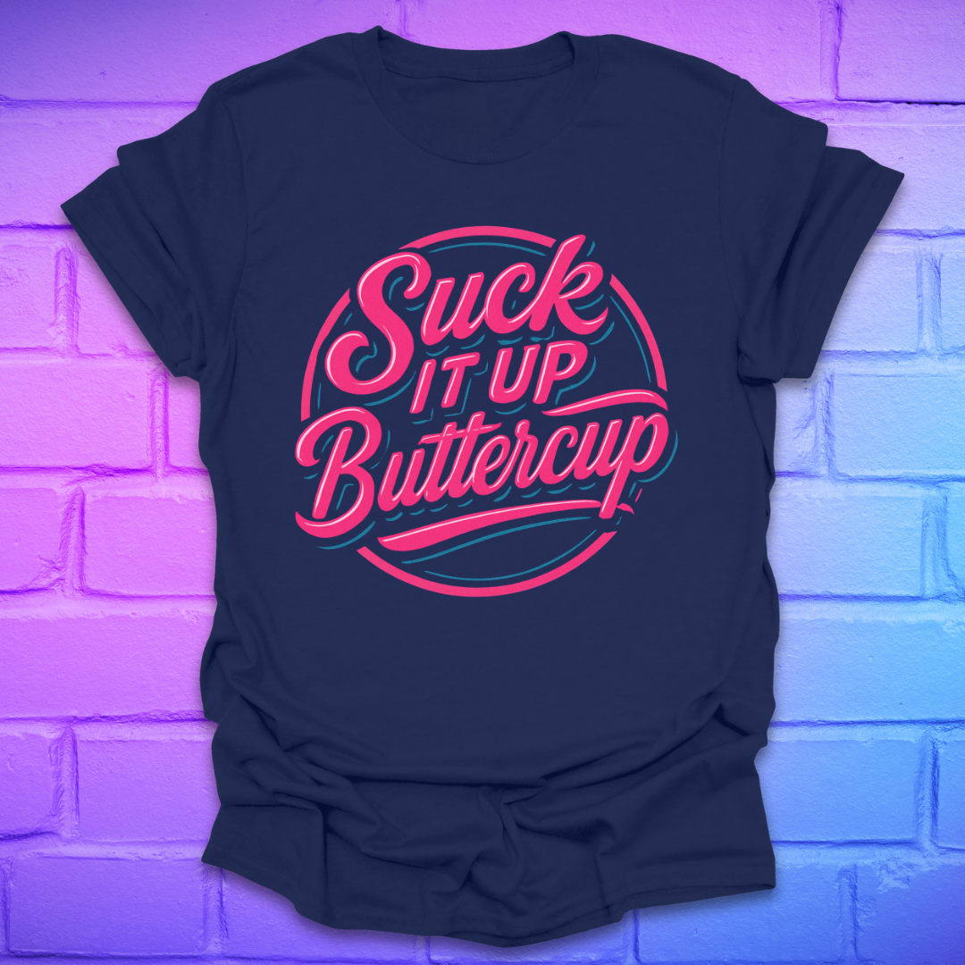 Navy blue t-shirt with pink and white text 'Suck It Up Buttercup' on a brick wall background