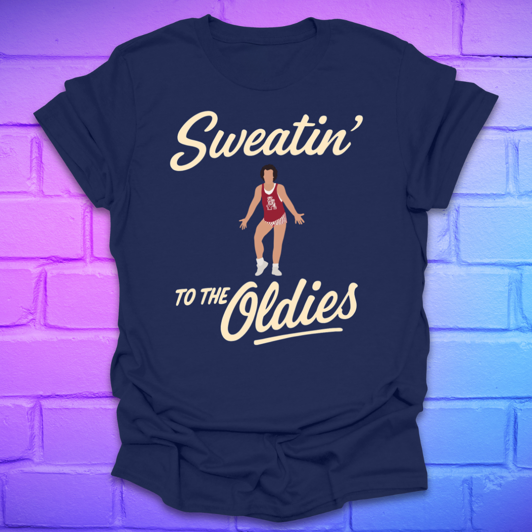 Navy blue t-shirt with 'Sweatin' to the Oldies' text and graphic on a brick wall background