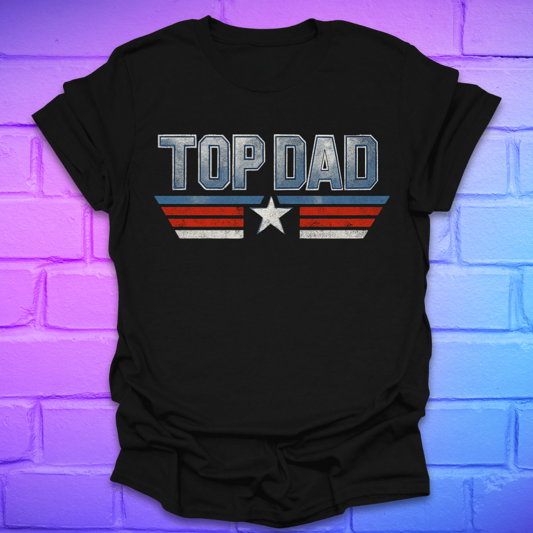 Black t-shirt with text 'Top Dad' with red, white and blue stripes and a star on a brick background.