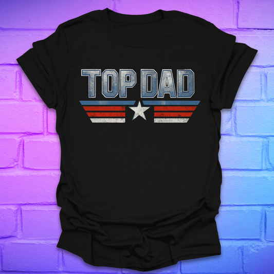 Black t-shirt with text 'Top Dad' with red, white and blue stripes and a star on a brick background.