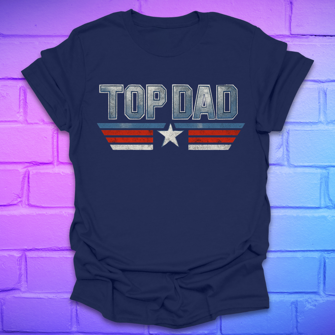 Navy blue t-shirt with text 'Top Dad' with red, white and blue stripes and a star on a brick background.