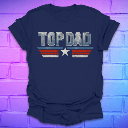 Navy blue t-shirt with text 'Top Dad' with red, white and blue stripes and a star on a brick background.