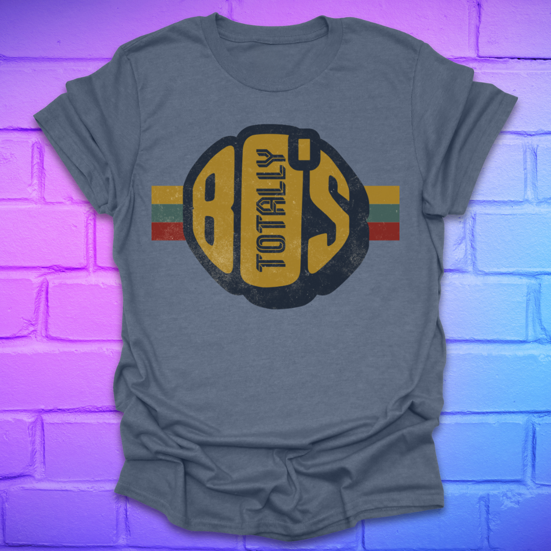 Indigo t-shirt with a large retro graphic reading 'Totally 80's' with a colorful stripe on a brick background.
