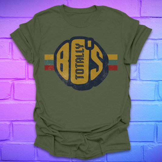 Green t-shirt with a large retro graphic reading 'Totally 80's' with a colorful stripe on a brick background.