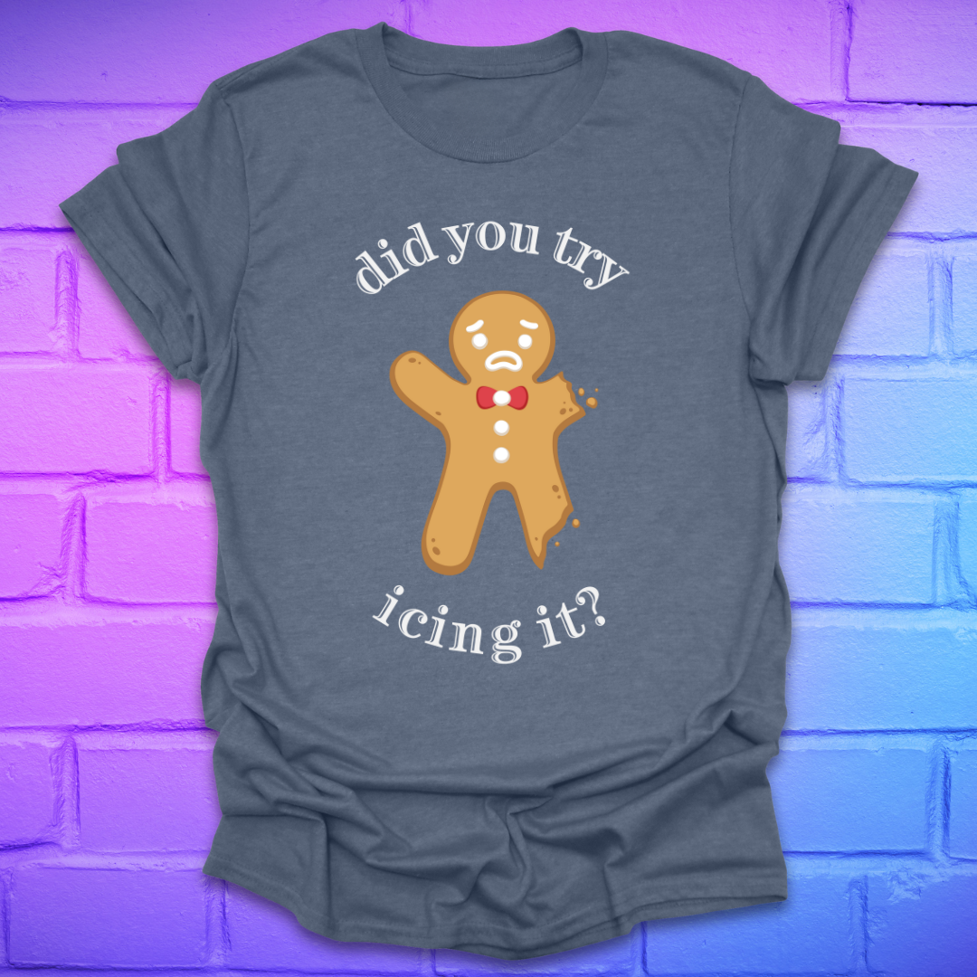 Blue grey t-shirt with a gingerbread man graphic and text, 'did you try icing it?' on a purple brick wall background