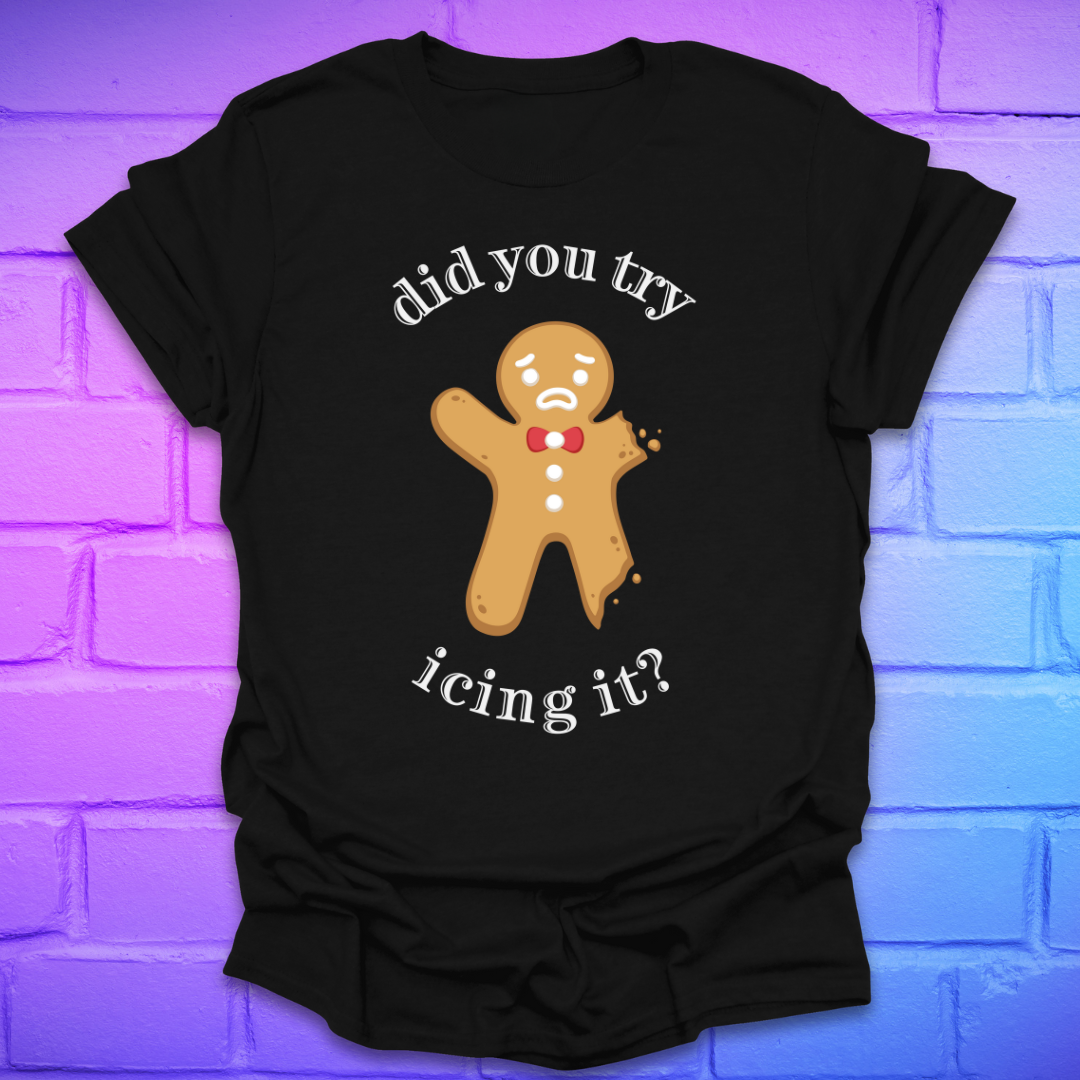 Black t-shirt with a gingerbread man graphic and text, 'did you try icing it?' on a purple brick wall background