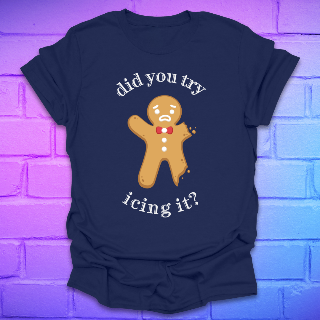 Navy blue t-shirt with a gingerbread man graphic and text, 'did you try icing it?' on a purple brick wall background