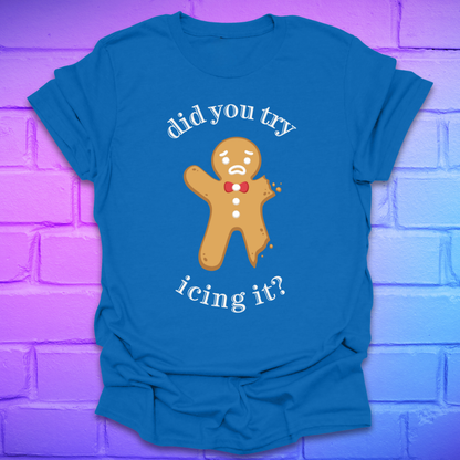 Royal Blue t-shirt with a gingerbread man graphic and text, 'did you try icing it?' on a purple brick wall background