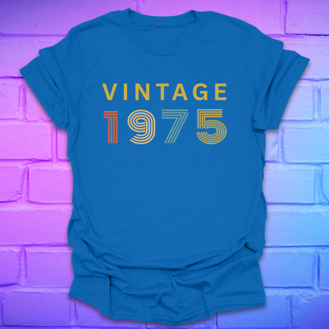 Royal tshirt with text 'Vintage 1975' in a retro font, on a brick background.
