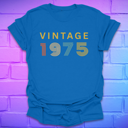 Royal tshirt with text 'Vintage 1975' in a retro font, on a brick background.