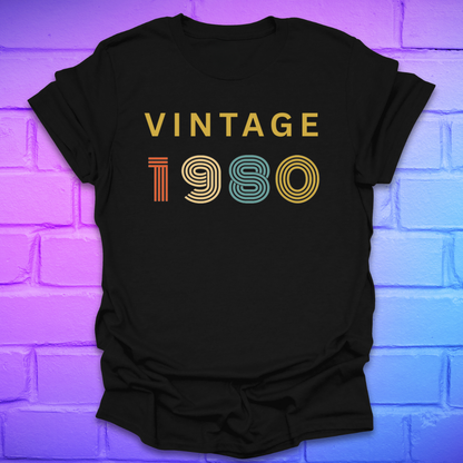 Black t-shirt with 'Vintage 1980' text on a brick wall background