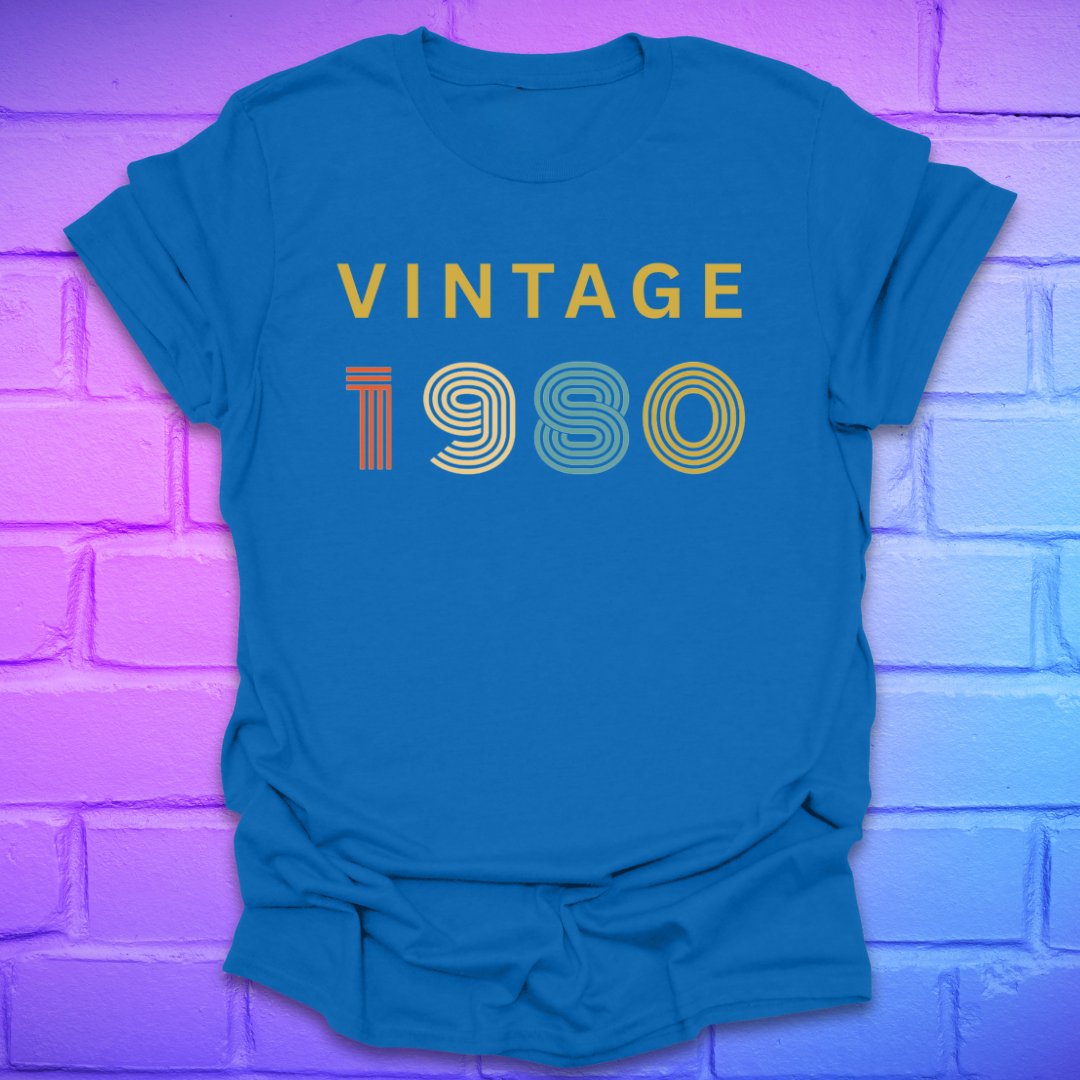Royal blue t-shirt with 'Vintage 1980' text on a brick wall background