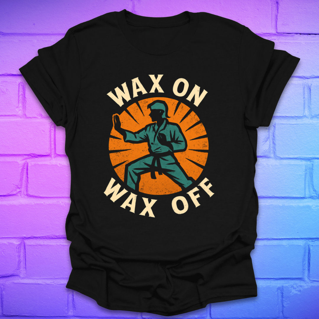 Black t-shirt with 'Wax On Wax Off' graphic design on a brick wall background